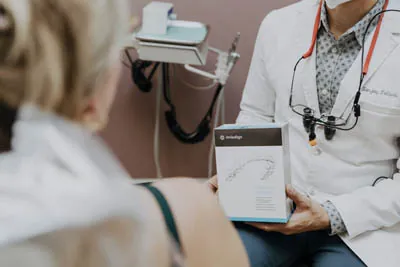 Dr. Talluri showing Invisalign to a patient