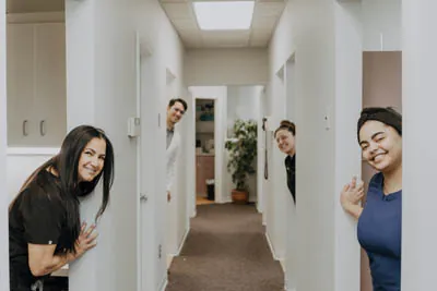 The Exquisite Dentistry staff posing in their office