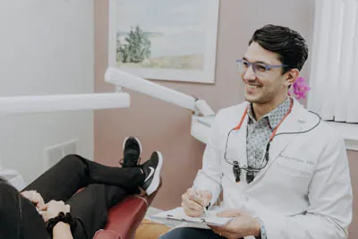 Dr. Talluri listening to a patient's dental issues