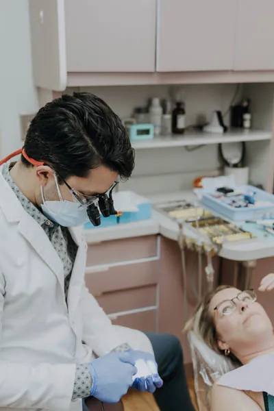 Dr. Talluri working on a patient's smile