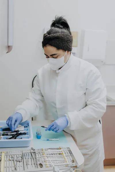 Exquisite Dentistry hygienist getting her dental cleaning tools ready for the next patient