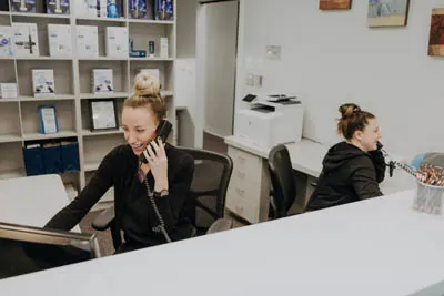 front office coordinators scheduling dental appointments at Exquisite Dentistry