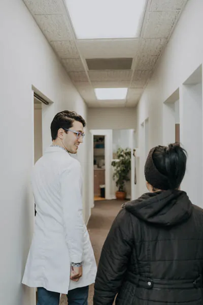 Dr. Talluri escorting a patient to his office to discuss nutrition counseling